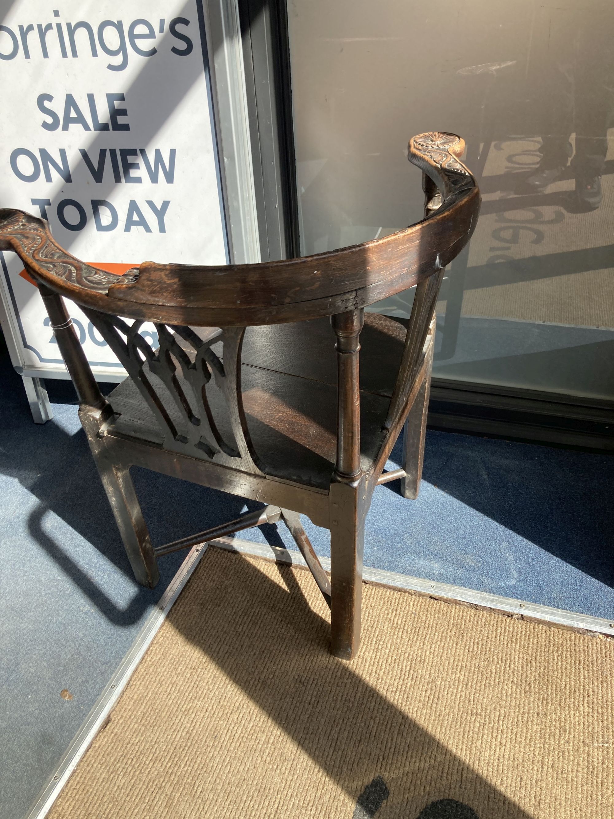 A George III carved mahogany corner elbow chair, width 76cm, depth 64cm, height 82cm